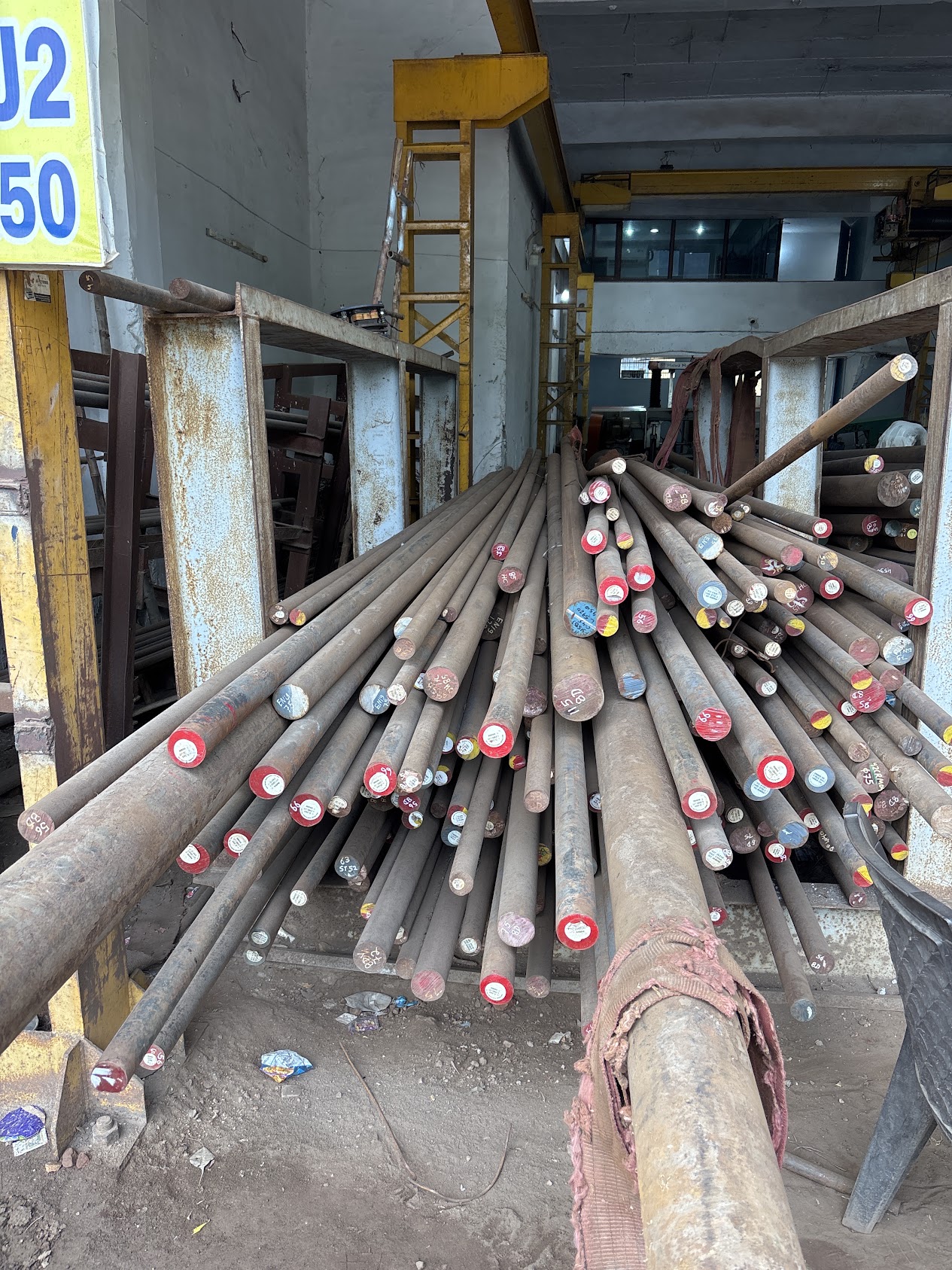 Round bars stacked indoors